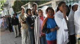 Eritreans stand in long lines for milk and other staples at stores. Shoppers sometimes wait for hours for a single loaf of bread.