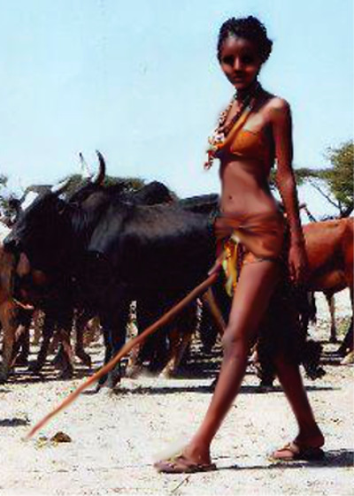 Ethiopian beautyful girl watching her cows